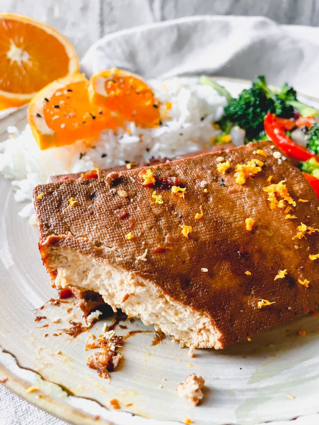 Baked Tofu with and orange ginger marinade and fresh orange zest.