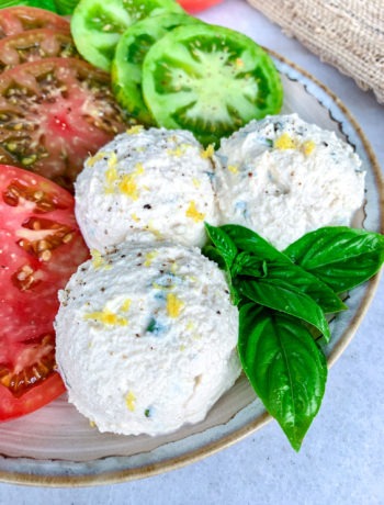 Three scoops of tofu ricotta with fresh basil and heirloom tomatoes.